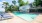 Resort-style swimming pool with lounge seating