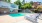 Resort-style swimming pool with lounge seating